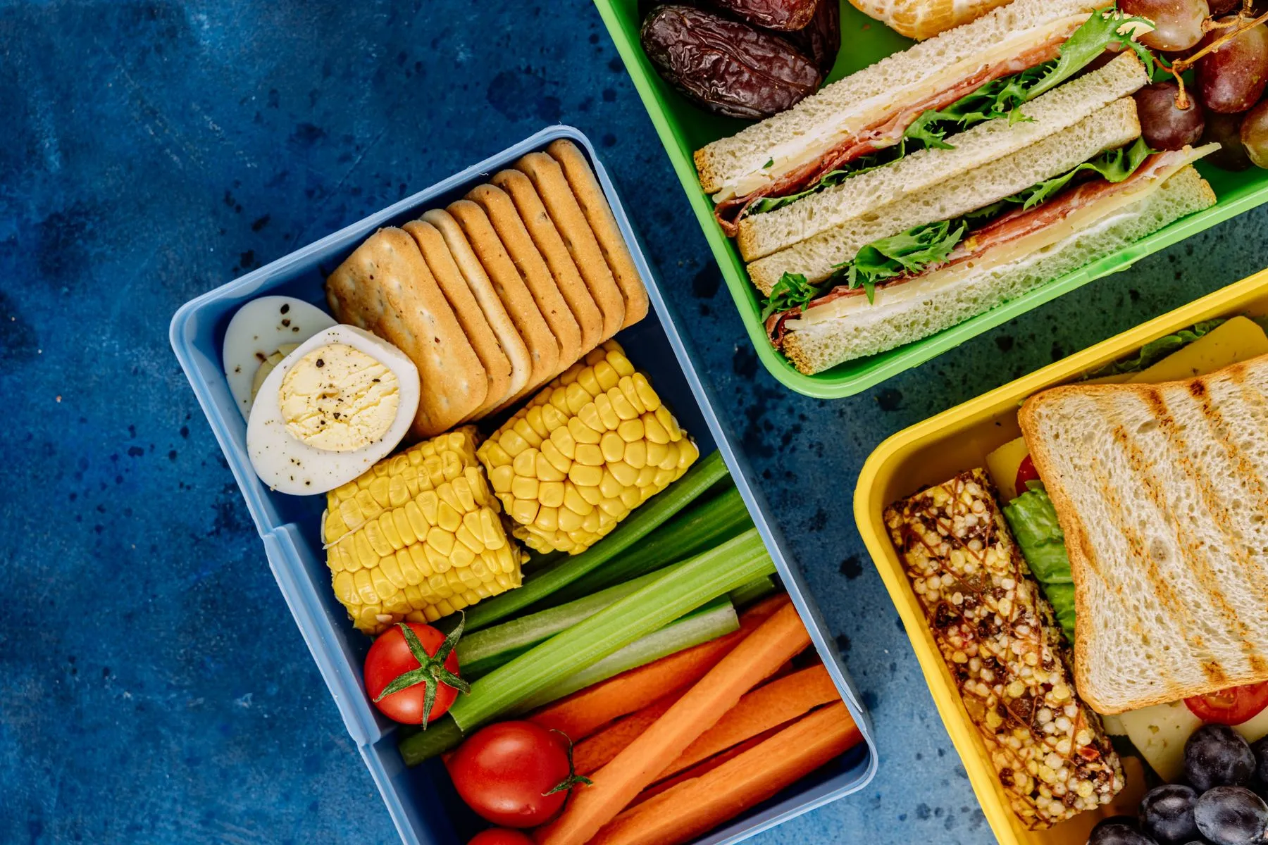 Balanced children's meals laid out in compartment trays