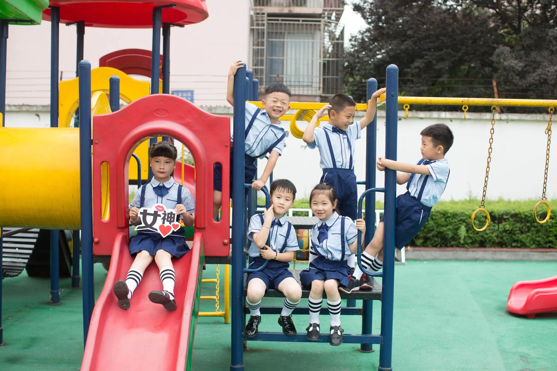 Children playing on outdoor playground equipment